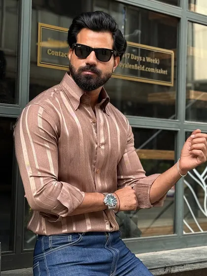 This close-up shot highlights the texture of the satin fabric and the shirt's impeccable fit, perfect for a smart-casual look.