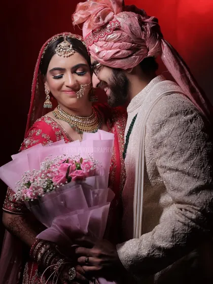 A tender moment between the bride and groom, filled with emotion and soft lighting.