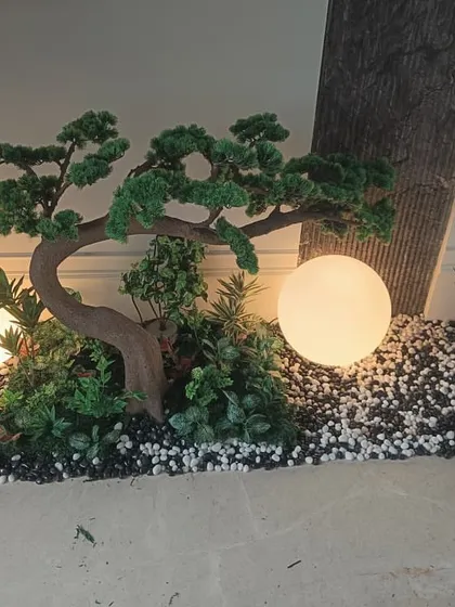 Another angle of the bonsai planter with globe lights, showing how it looks from a seated position.