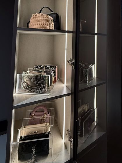 We use clear acrylic stands to display clutches and small handbags. This not only keeps them organized but also turns them into a beautiful, boutique-like display.