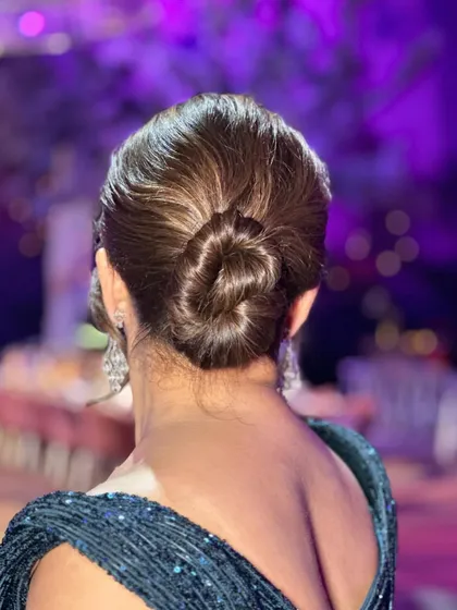 Another angle of the single twisted bun, showing its clean lines and elegant shape.