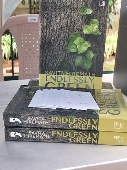 A close-up of my book, "Endlessly Green," at our event stall. It's always a proud moment to see the physical result of years of hard work and research.