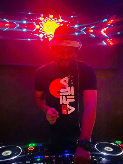 In the red zone at Bombay Cartel. The intense lighting matches the high energy of my Friday night Bollywood sets.