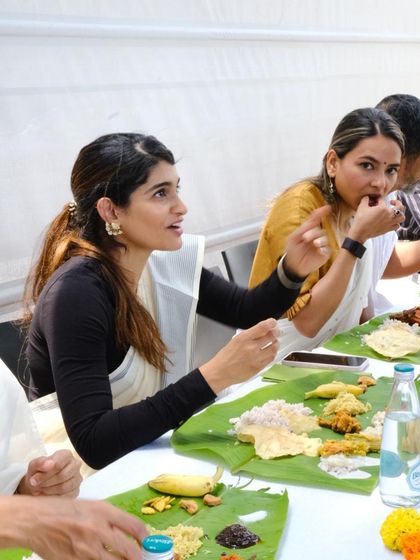 The joy of a festival is best shared over a meal. Here are some of my guests, dressed in their festive best, enjoying the Onam Sadhya I catered. I can create this authentic experience for your celebrations too.