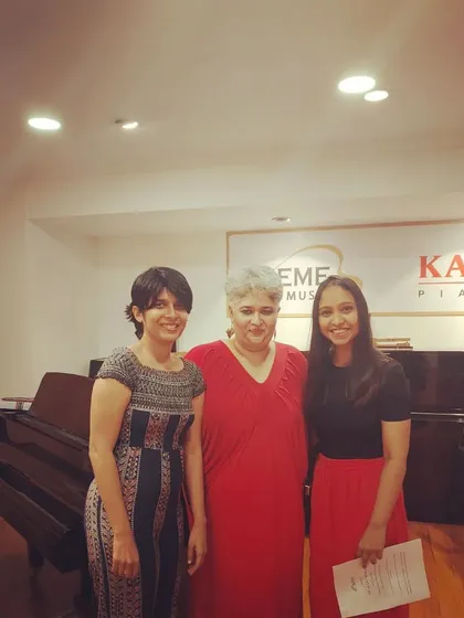 This picture is with my teacher, who helped me when I was struggling with my own voice and confidence. My coaching is built on this experience. I understand the self-doubt that can hold you back, and I create a space where it's safe to be vulnerable, to stumble, and to grow without judgment.