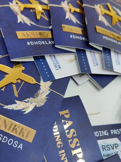 Perfect for destination weddings or travel-loving couples, this passport-style invitation is one of my most creative formats. It includes a "boarding pass" for event details and is finished with a custom gold acrylic airplane motif.