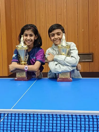 Our U-11 champions, Saksha and Arnav, with their trophies after another successful state tournament. Their friendly rivalry pushes them both to be better.
