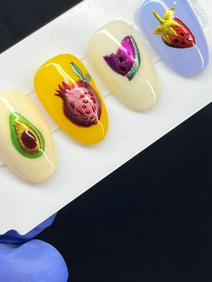Another view of the playful and colorful fruit-themed nail art set.