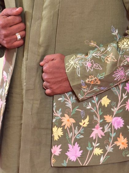 A close-up of the custom hand embroidery on our 100% hemp koti. The fabric is highly breathable and eco-friendly, allowing for both comfort and conscious style.