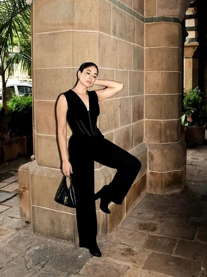 This all-black jumpsuit from Mamkam is the definition of sleek and stunning. The corseted top and wide-leg pants create a powerful and flattering silhouette.
