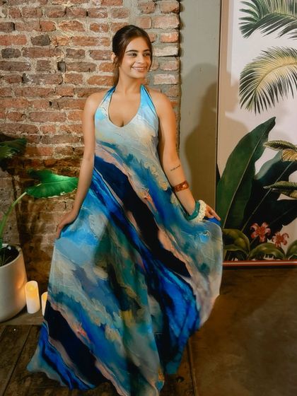 Another shot of this flowy, wave-print dress. The A-line cut is incredibly flattering as it skims over the hips and thighs, allowing for beautiful movement.