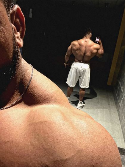 Alpha mentality. A creative shot showing the back and shoulder development.