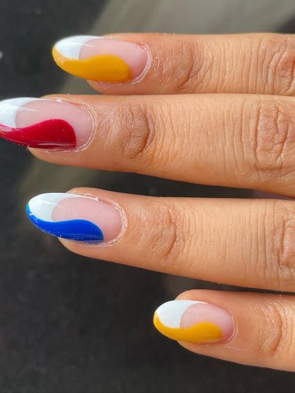 A close-up showing the clean, crisp lines of the colorful waves against the natural nail base. It's a sophisticated yet playful look.