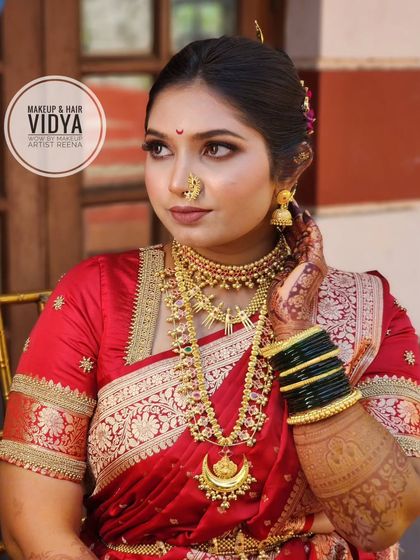 Priya looking absolutely stunning. This shot highlights her flawless makeup, the crescent moon necklace, and the traditional Maharashtrian nath.