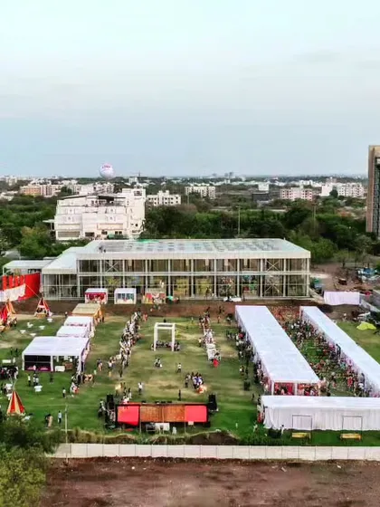 A ground-level view of our Glass Pavilion project, a versatile space for events and gatherings. The transparent design seamlessly blends the interior with the surrounding landscape.