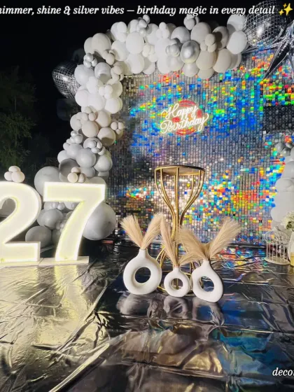 For a 27th birthday that needed to be extra glamorous, we designed this stunning silver sequin backdrop. The glowing marquee numbers and modern pampas grass decor created a chic, photo-perfect spot for a night of celebration.