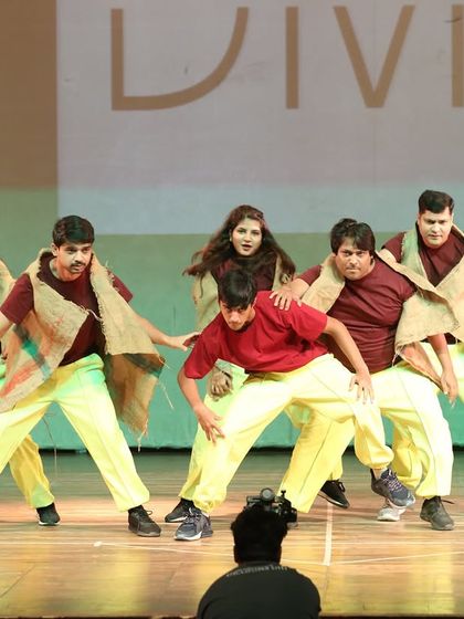 A powerful pose from a folk-contemporary fusion piece. The rustic costumes and intense expressions tell a story of their own, showcasing the diverse themes we explore in our choreography.