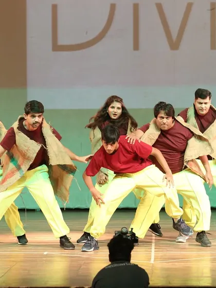 An intense, powerful moment captured on stage. This group's earthy costumes and strong poses made for a memorable performance.