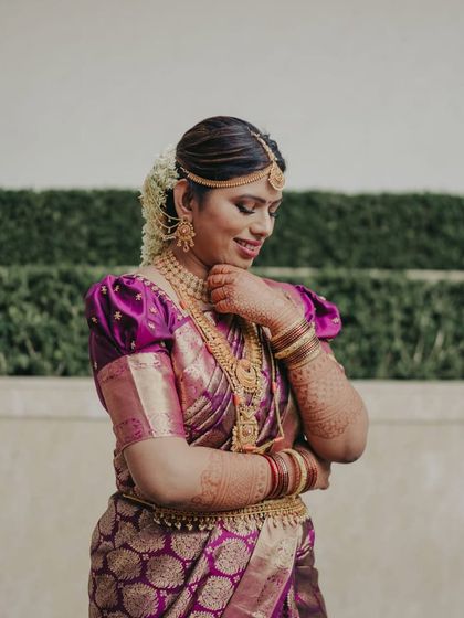 So cutely she poses. This bride's transformation was amazing, resulting in a look that is both traditional and full of personality.