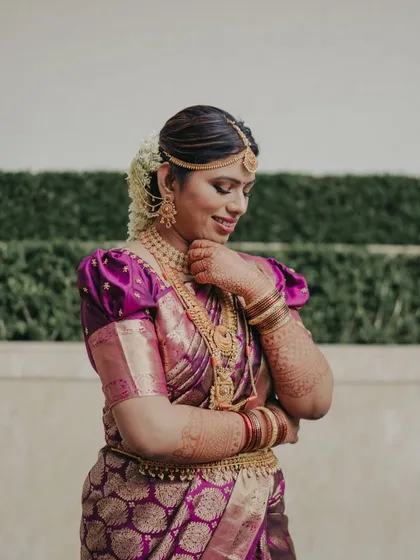 So cutely she poses. This bride's transformation was amazing, resulting in a look that is both traditional and full of personality.