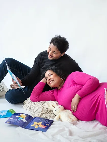 Reading a storybook to the bump is a sweet way to bond and a wonderful memory to capture during your session.