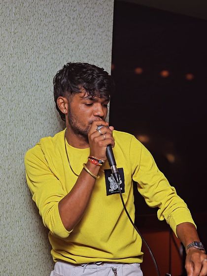 On the mic again, making sure the energy in the room is always at its peak.