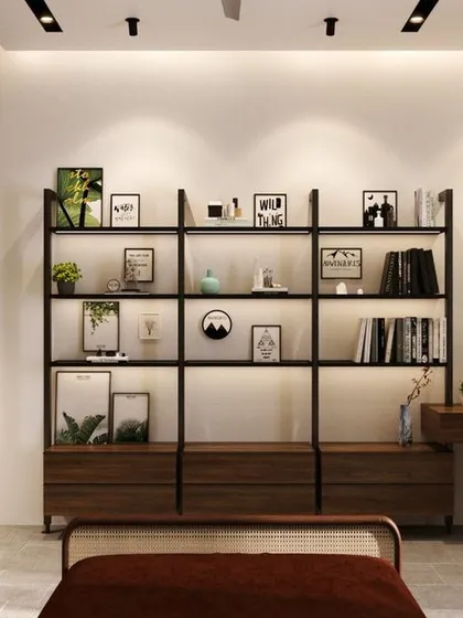 This minimal bedroom design includes a sleek, open-shelf library and integrated study desk. The use of backlighting and clean metal lines creates a functional workspace that feels light, organized, and perfectly suited for a modern residence.