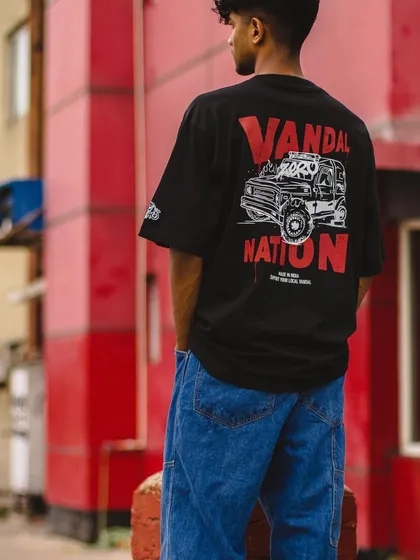 My art isn't just for walls. Here's a look at the 'Vandal Nation' T-shirt, a piece of merchandise I designed. It shows how my graffiti style translates into wearable art for brand collaborations.