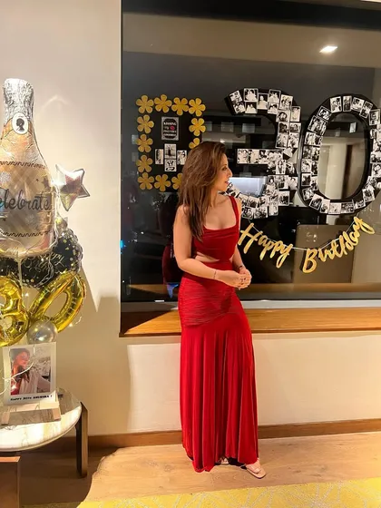 Celebrating a special birthday in a stunning red gown. I believe in celebrating life's big moments in style.