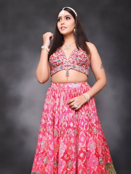 A modern take on a festive look with this vibrant pink lehenga. I created a soft smokey eye with a hint of purple and a glowing base, perfect for a contemporary sangeet or reception party.