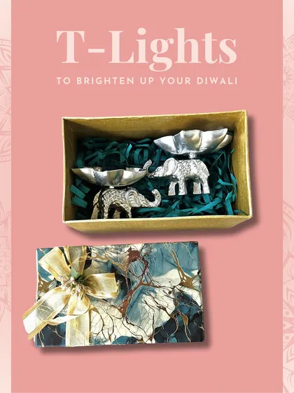 A set of two silver elephant T-light holders in a gift box. These are always a popular choice for their charm and auspicious symbolism.