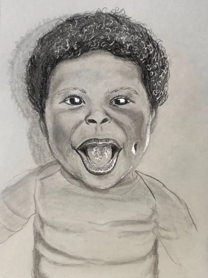 Another angle of the laughing child portrait, showing the shading and detail work that brings the sketch to life.