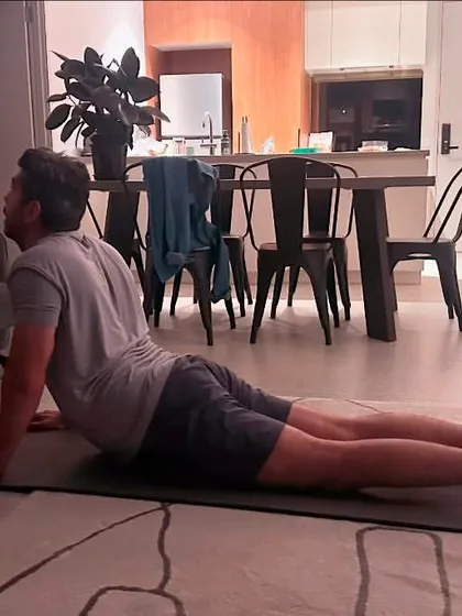 A look into a personalized one on one yoga session at a client's home. I tailor these classes to focus on specific goals, like improving flexibility with poses such as Bhujangasana or cobra pose.
