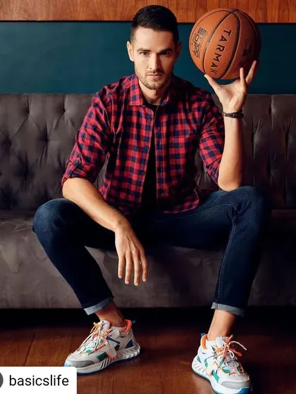 Capturing the active and cool vibe for a Basics Life menswear campaign. We styled this red and black plaid shirt over a simple tee with dark denim for a timeless, casual look. The basketball prop adds a touch of personality and energy that makes the brand's story come alive.