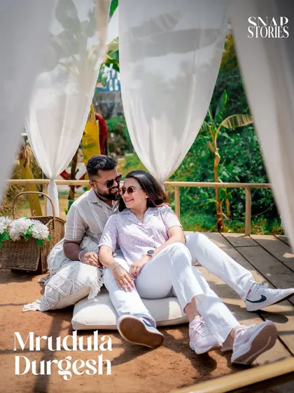 A relaxed and casual shot of a couple enjoying a picnic-style setup. This shows how we can create a comfortable and personal pre-wedding experience.