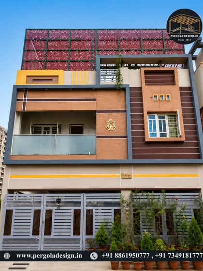 The front facade of a modern home featuring a large, decorative laser-cut screen on the top floor. This serves as both a privacy feature and a bold architectural statement.