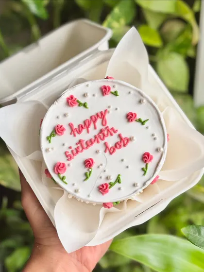Sweet sixteen never looked this pretty! A delicate bento cake with tiny pink rosettes and pearls, perfect for a special milestone.