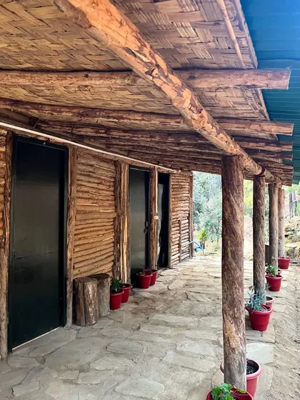 The exterior of Rakesh's hand-built camp, made with local wood and materials. It's a place to connect with nature after a long day of riding.