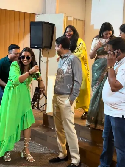 Interacting with the crowd during a silver jubilee celebration. My goal is to create a fun and relaxed atmosphere where everyone feels comfortable joining in.