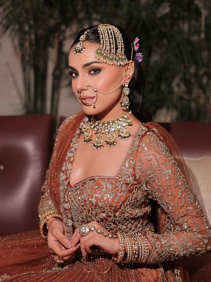 Elegance redefined for the modern wedding guest. This look features a unique passa and smokey eyes for a contemporary yet traditional feel.