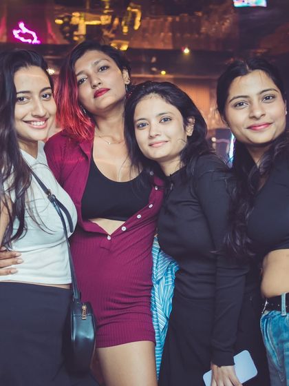 A group of friends ready for their night out. Thursday nights at Happy Brew are a staple of the Bangalore nightlife scene.