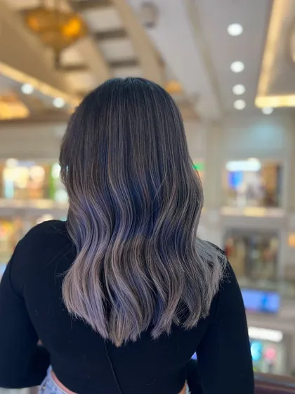 Ash hair color is like a breath of fresh air. This cool, smoky grey-blue is a modern and sophisticated choice for a striking look.