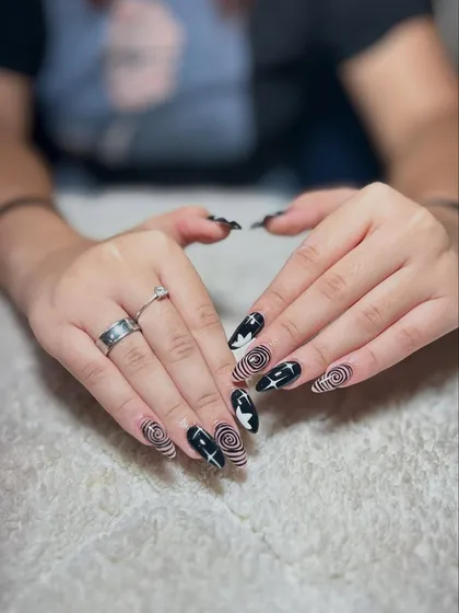 A hypnotic black and white spiral design with star accents. This kind of precise line work is a skill we practice extensively in my classes.
