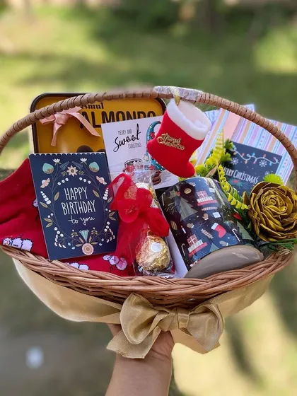We love creating gifts that celebrate multiple special moments at once. This custom wicker basket was designed as a combined Christmas and Birthday hamper, featuring festive holiday items alongside a personal birthday card and treats.