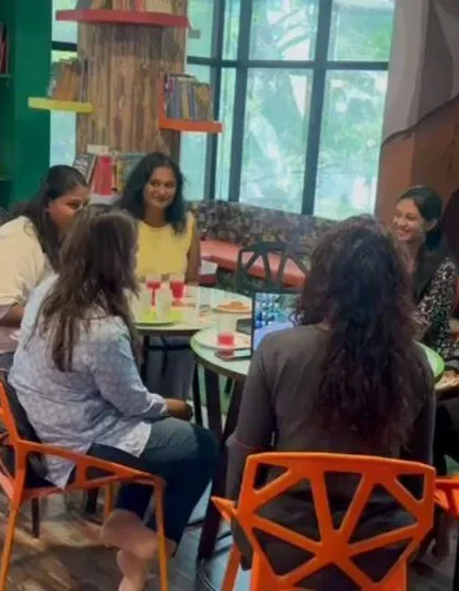 We are more than just a play area; we are a community. This photo is from one of our "Mommy Moments" playdates, where mothers connect and share experiences while their children play nearby.