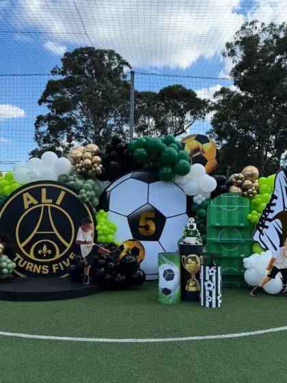 GOAL! For the little sports star in your family, we create action-packed themes like this football party. We transformed an entire field with custom backdrops, balloon arrangements, and themed props for a truly immersive experience.
