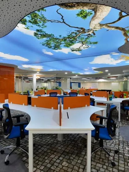Imagine working under an open sky every day. We used a custom stretch-lit ceiling to create this stunning effect in an open-plan office, transforming the workspace and boosting creativity.