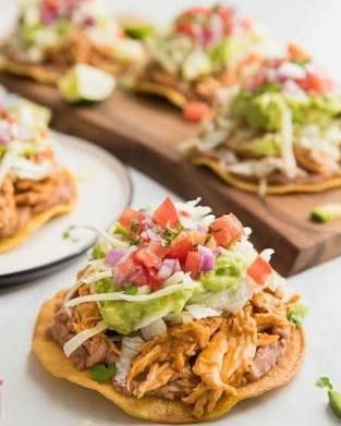 Classic chicken tostadas piled high with refried beans, shredded chicken, guacamole, and pico de gallo. This is a staple of our Mexican menu, delivering authentic and vibrant flavors.