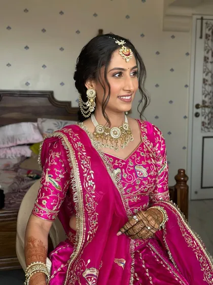 A candid shot showing her beautiful smile. The makeup is designed to look fresh and radiant throughout the long day of ceremonies.