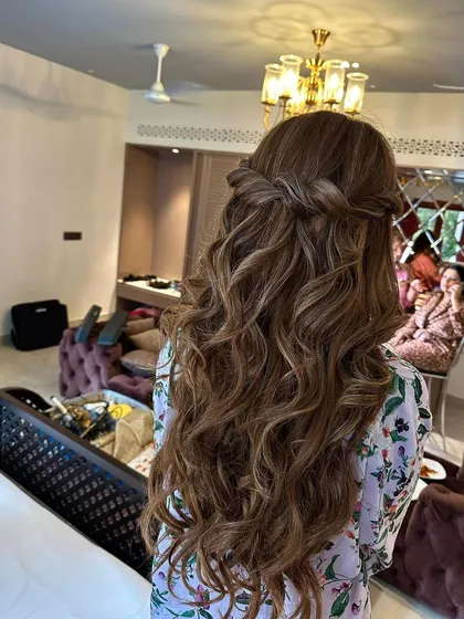 The art of styling. These long, beachy waves with a simple twist are perfect for a relaxed yet beautiful look.